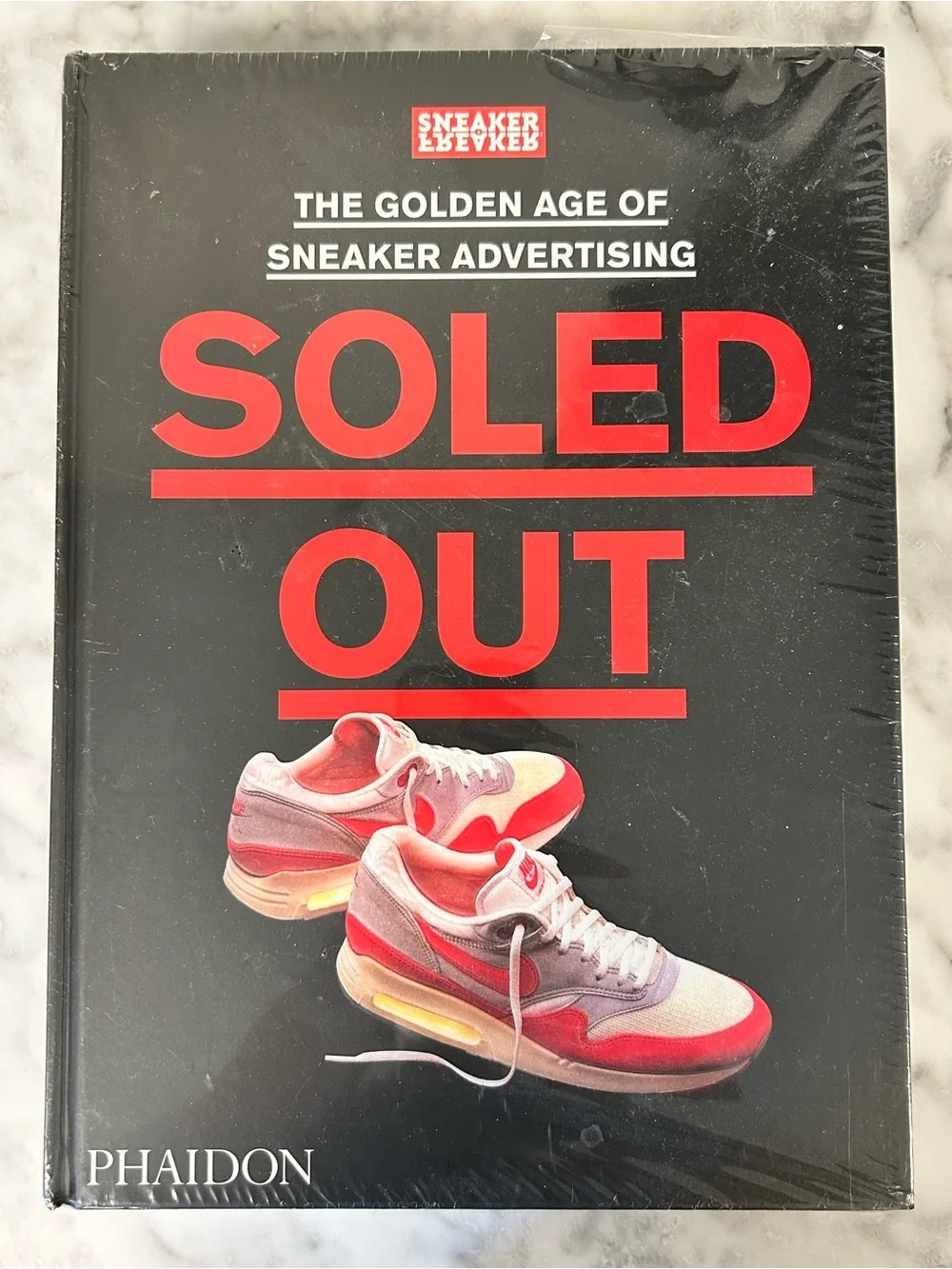 Hardcover Soled Out: The Golden Age of Sneaker Advertising • By: Phaidon